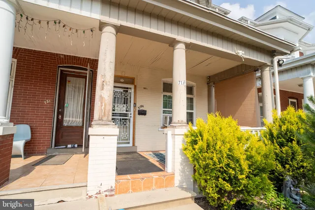 a front view of a house with a porch