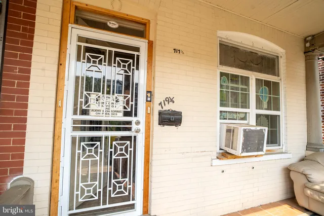 a front view of a house with a large window
