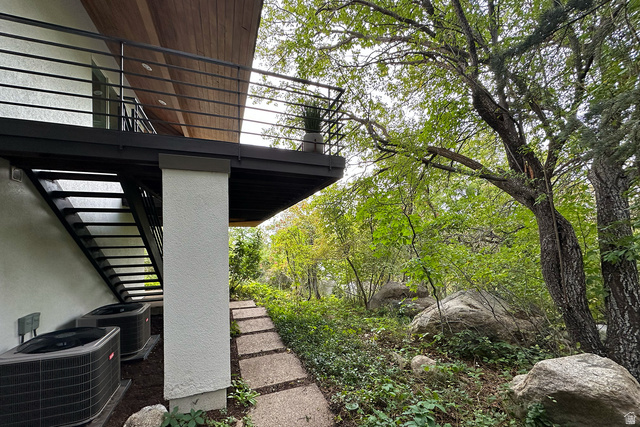 11454 South Oberland Road Sandy, UT 84092 - Photo 77 of 103 Exterior balcony with wood-finish soffit and sleek black railings