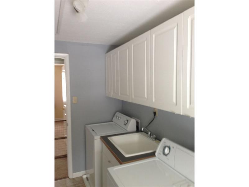 202 Brookside Road Economy, PA 15005 - Photo 18 of 25 Other. 2nd floor walk in laundry room with cabinets & sink folding counter & hanging bar