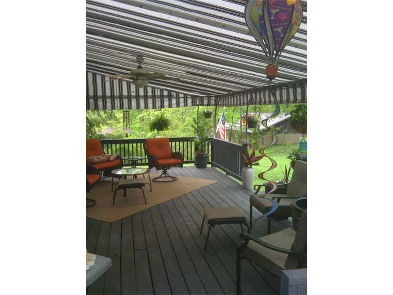 202 Brookside Road Economy, PA 15005 - Photo 22 of 25 Patio/Deck. wonderful awning for 18 x 25 deck which opens to patio area & firepit