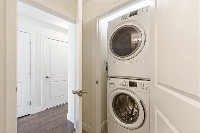 a view of a hallway with washer and dryer