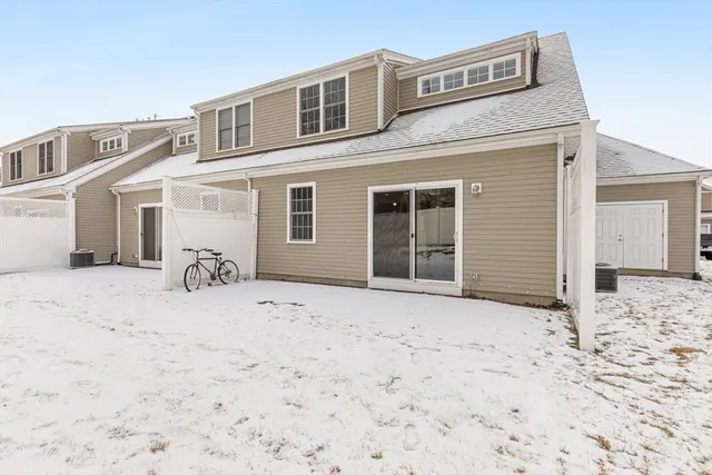 a view of house with snow on the side of road