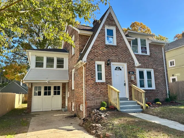 a front view of a house with a yard