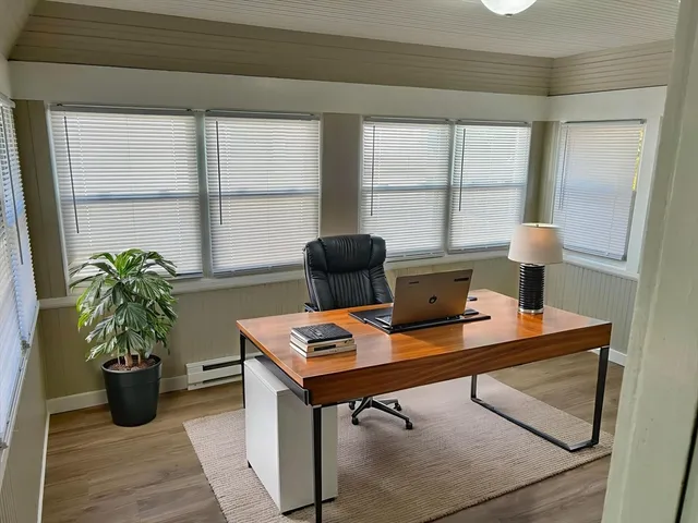 a workspace with furniture and window