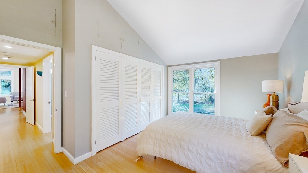 12 Ellis Road Weston, MA 02493 - Photo 13 of 42 a bedroom with a bed and wooden floor