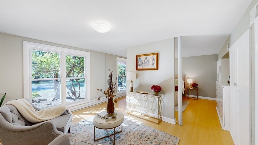 12 Ellis Road Weston, MA 02493 - Photo 17 of 42 a living room with furniture and a table