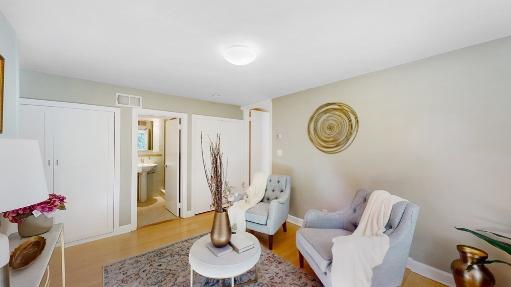 12 Ellis Road Weston, MA 02493 - Photo 18 of 42 a living room with furniture and a table