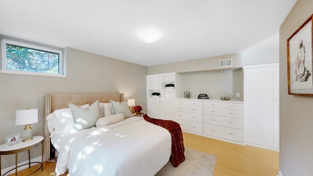 12 Ellis Road Weston, MA 02493 - Photo 19 of 42 a bedroom with a bed and a window