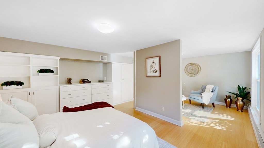 12 Ellis Road Weston, MA 02493 - Photo 21 of 42 a bedroom with a bed and a couch