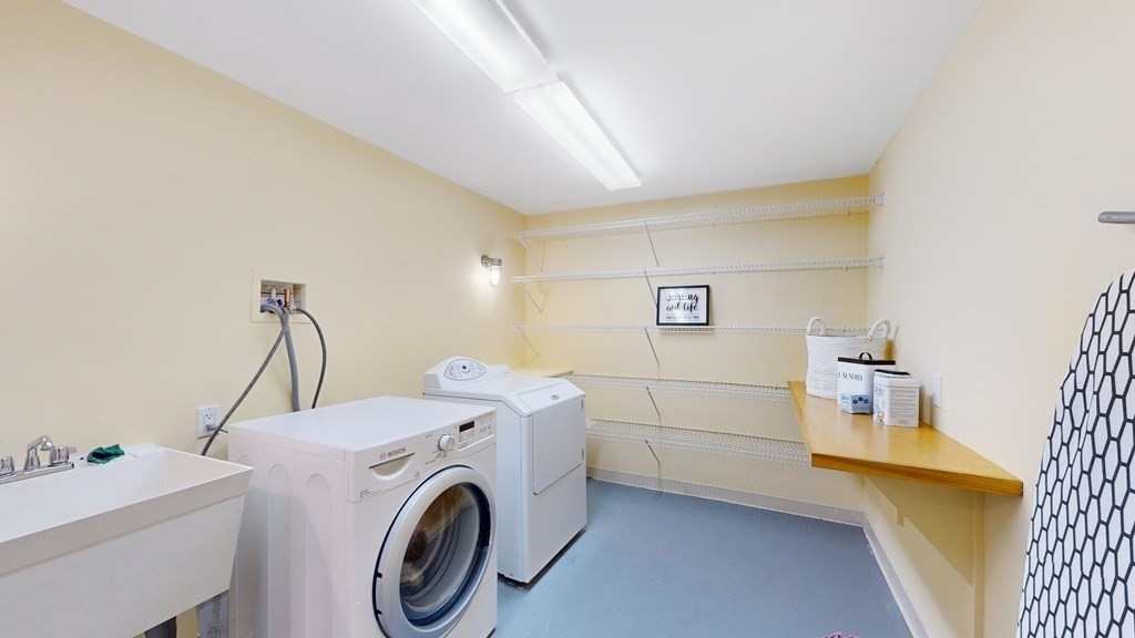 12 Ellis Road Weston, MA 02493 - Photo 29 of 42 a utility room with dryer and washer