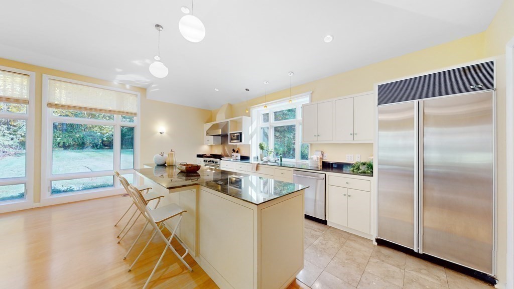 12 Ellis Road Weston, MA 02493 - Photo 3 of 42 a kitchen with appliances cabinets and a counter top space