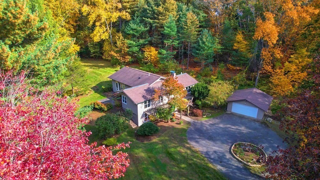 12 Ellis Road Weston, MA 02493 - Photo 32 of 42 an aerial view of a house with garden space seating area and trees all around