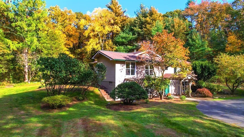 12 Ellis Road Weston, MA 02493 - Photo 35 of 42 a front view of a house with a yard