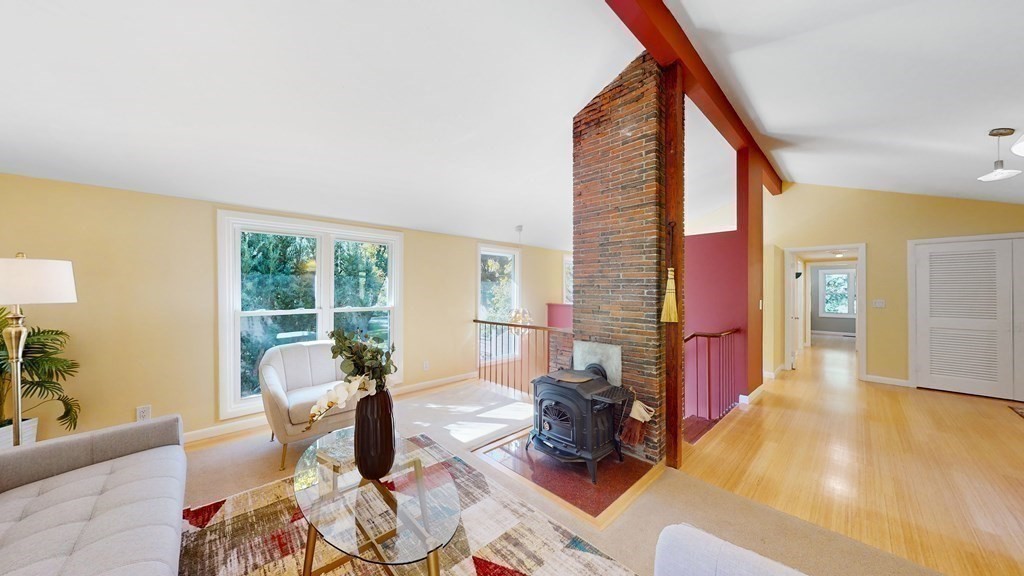 12 Ellis Road Weston, MA 02493 - Photo 6 of 42 a living room with furniture large window and wooden floor