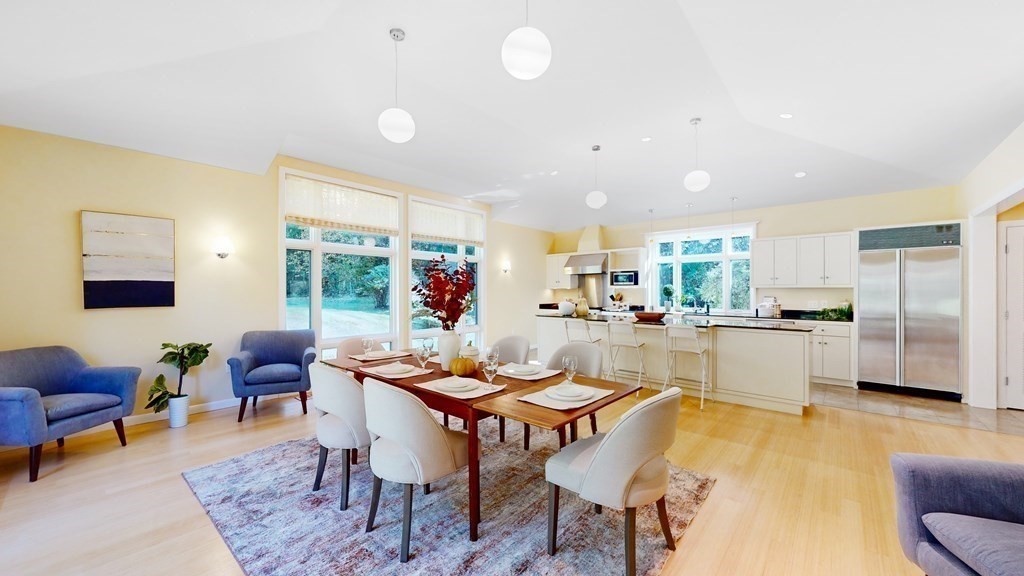 12 Ellis Road Weston, MA 02493 - Photo 10 of 42 a dining room with furniture and a floor to ceiling window
