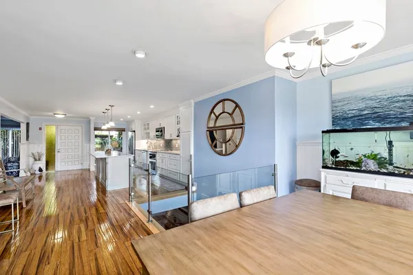 a living room filled with furniture and a chandelier