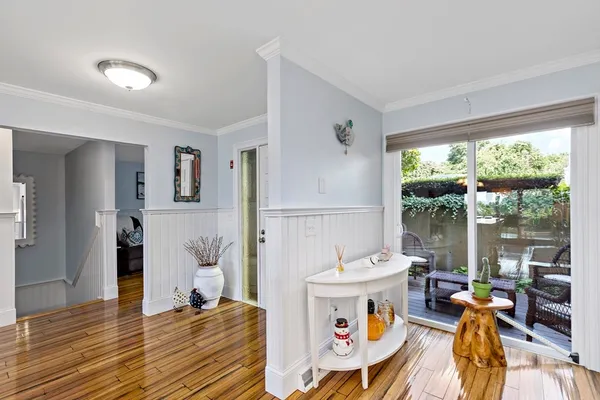 a very nice looking dining room with a large window and dining table