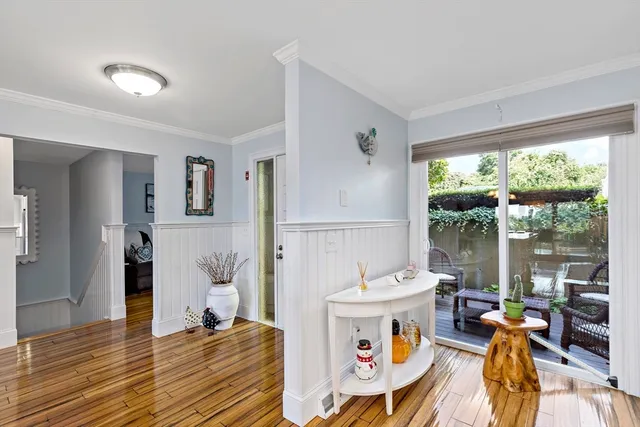 a very nice looking dining room with a large window and dining table