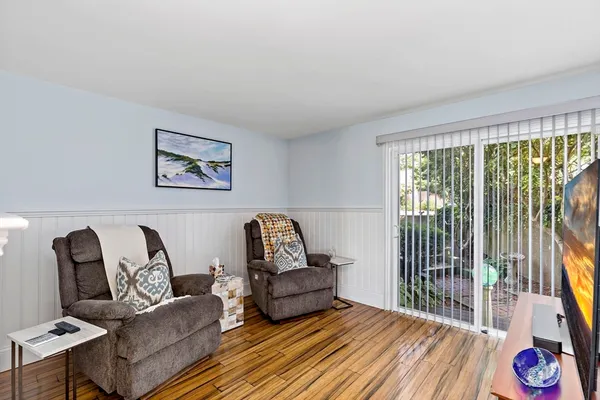 a living room with furniture fireplace and flat screen tv