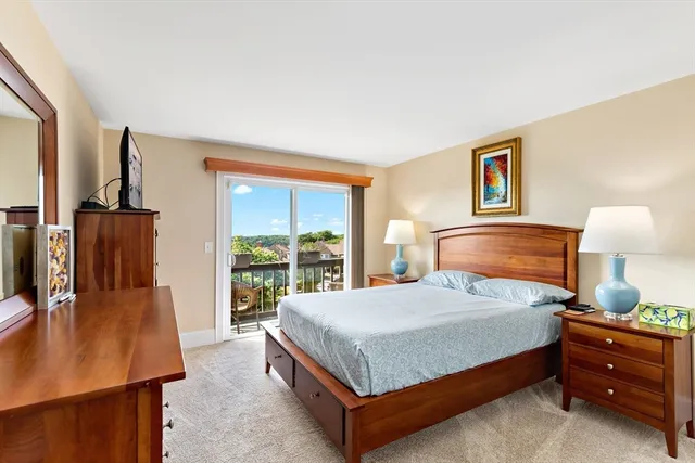 a bedroom with a bed and a table in it