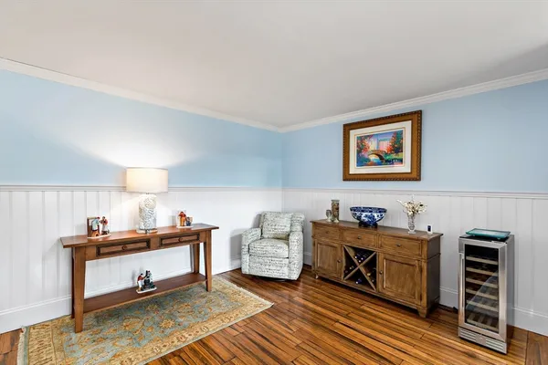 a bedroom with furniture and a book shelf