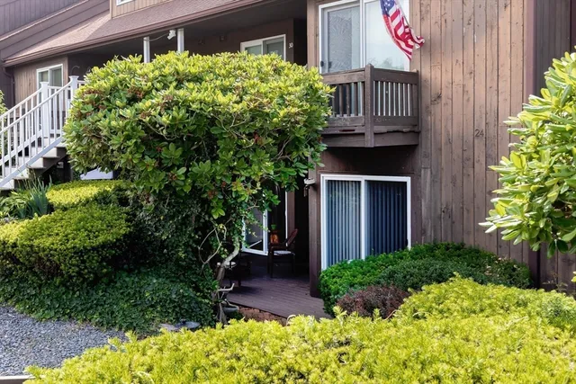 a front view of a house with garden