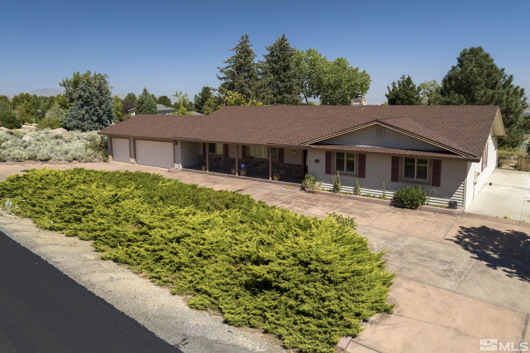 1645 Star Way Reno, NV 89511 - Photo 1 of 36 a front view of a house with a garden