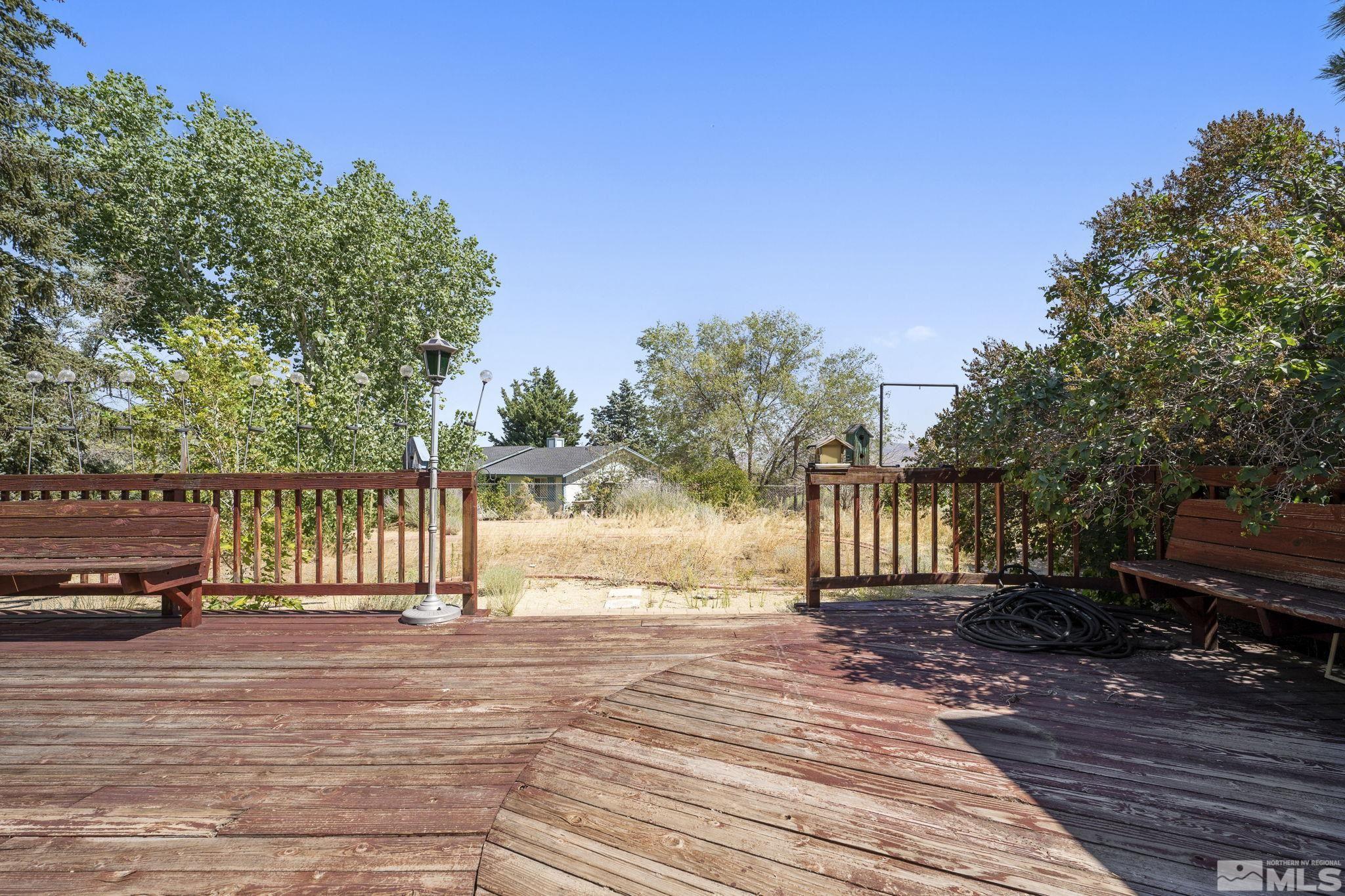 1645 Star Way Reno, NV 89511 - Photo 26 of 36 a view of backyard with deck and wooden floor