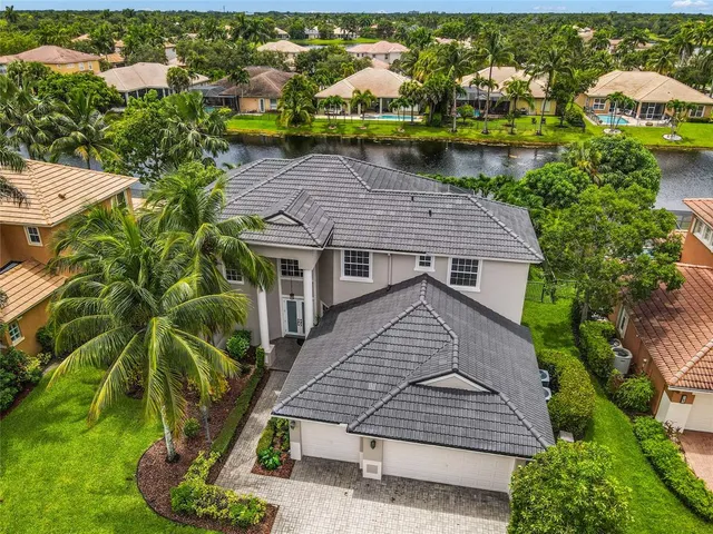 an aerial view of houses with yard