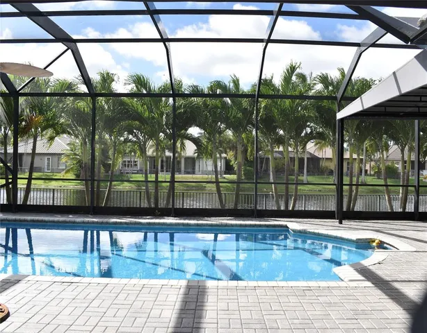 a view of a swimming pool with a lake view