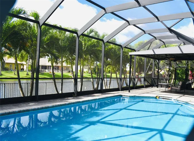 a swimming pool with a outdoor seating