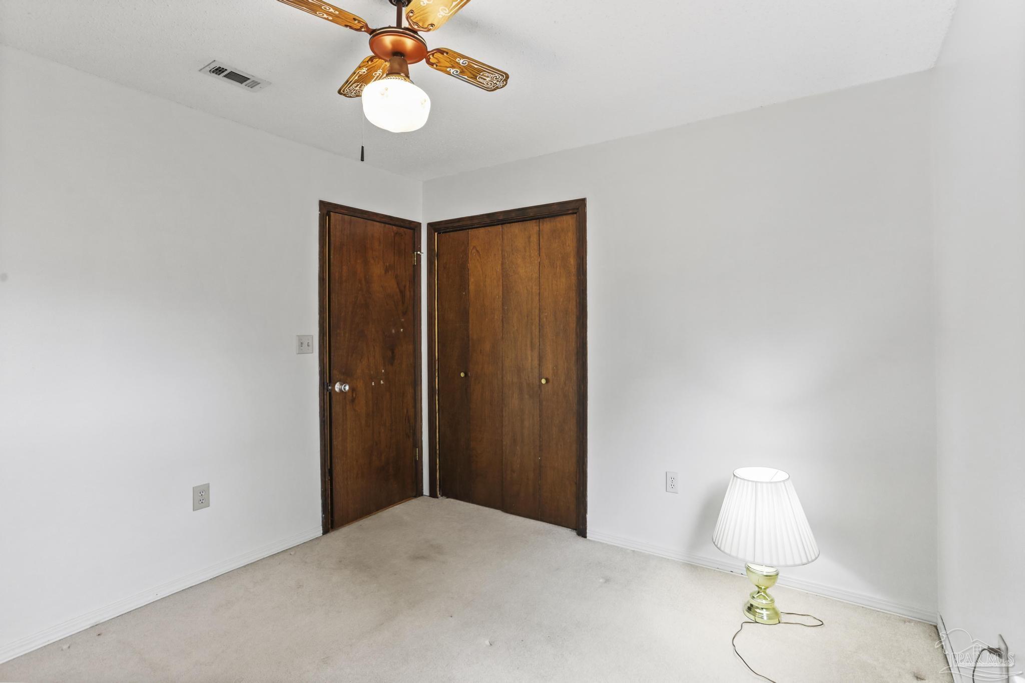 766 Ridge Lake Road Crestview, FL 32536 - Photo 19 of 43 a workspace room with a chandelier fan and a window