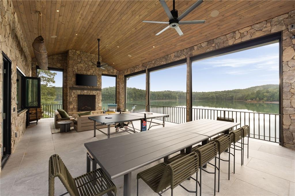725 Rocky Point Drive Morganton, GA 30560 - Photo 119 of 157 a view of a dining room with furniture large windows and wooden floor