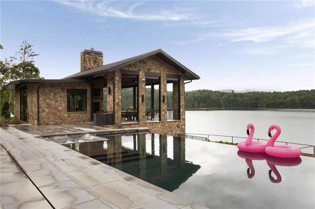 725 Rocky Point Drive Morganton, GA 30560 - Photo 137 of 157 a view of a house with sitting area and garden