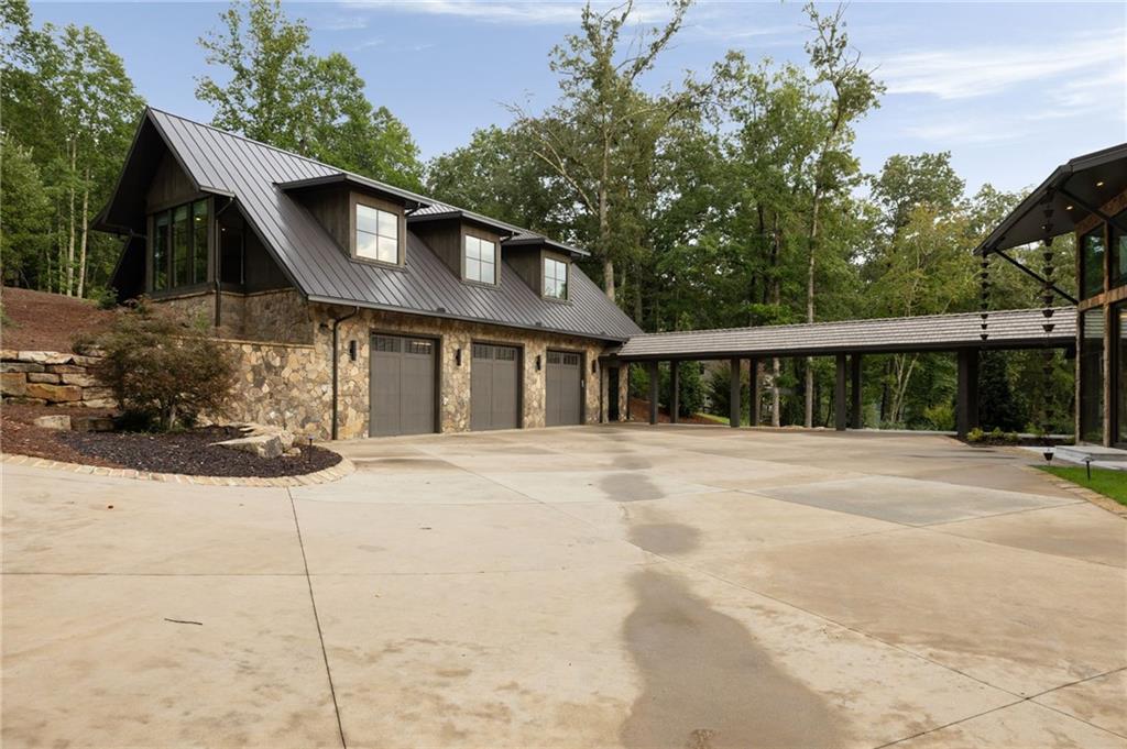 725 Rocky Point Drive Morganton, GA 30560 - Photo 24 of 157 a front view of a house with a yard and garage