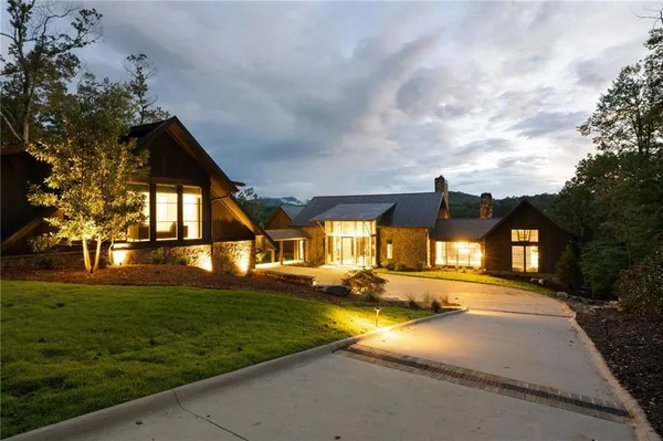 an aerial view of a house with outdoor space