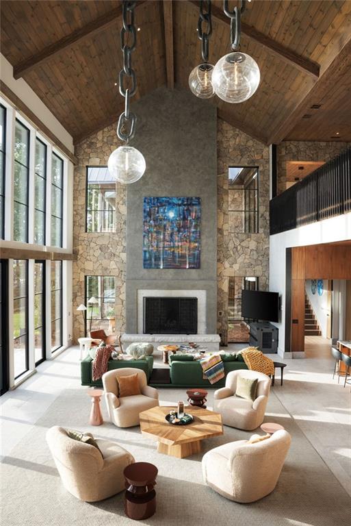 725 Rocky Point Drive Morganton, GA 30560 - Photo 32 of 157 a living room with furniture a fireplace and a large window