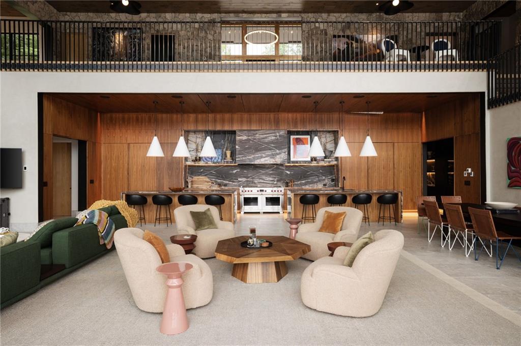 725 Rocky Point Drive Morganton, GA 30560 - Photo 35 of 157 a living room with furniture a chandelier and a wooden floor