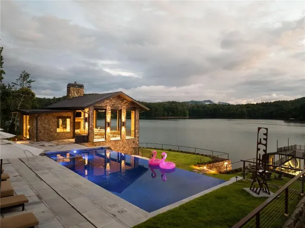 an aerial view of a house with garden space ocean view