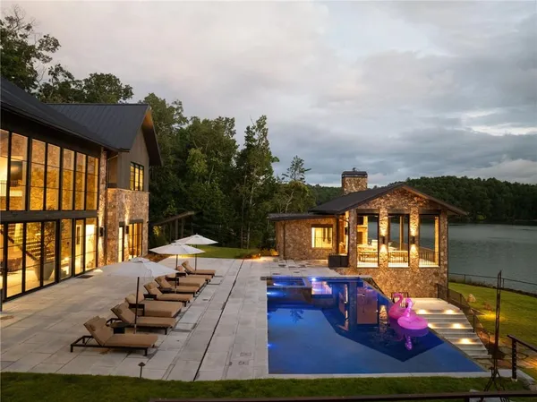 an aerial view of a house with garden space ocean view