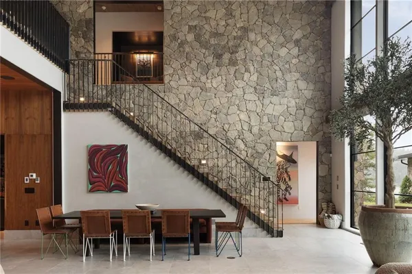 a view of a house with sitting area and garden