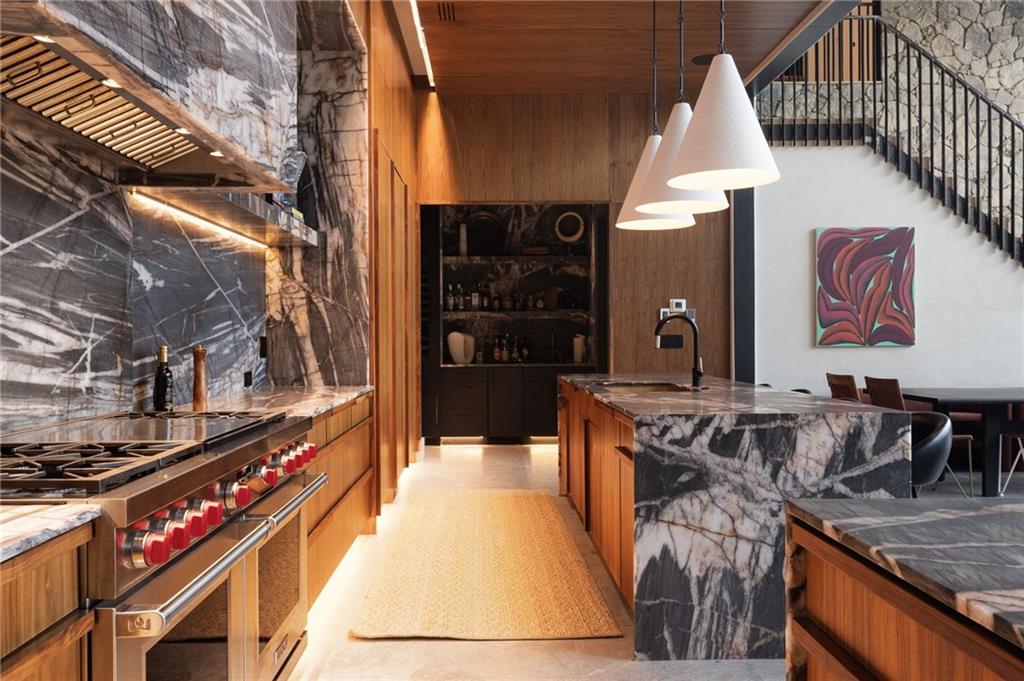 725 Rocky Point Drive Morganton, GA 30560 - Photo 49 of 157 a kitchen with stainless steel appliances granite countertop a stove a sink dishwasher and cabinets with wooden floor