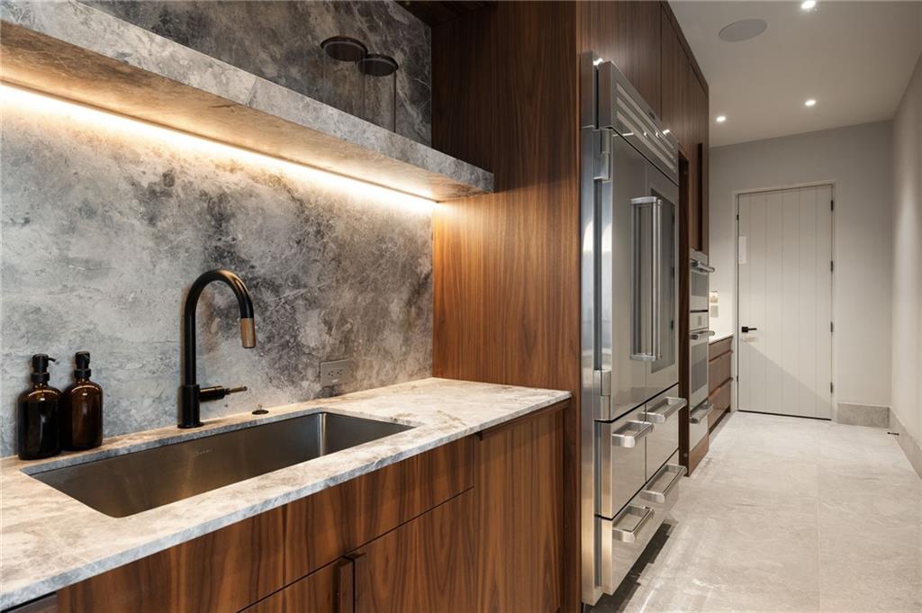 725 Rocky Point Drive Morganton, GA 30560 - Photo 56 of 157 a kitchen with a sink and a large mirror