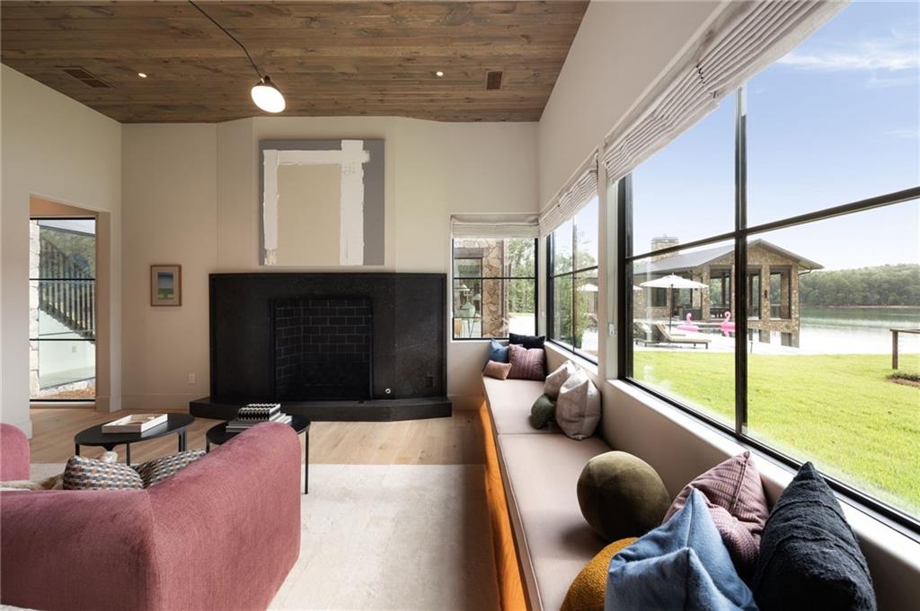 725 Rocky Point Drive Morganton, GA 30560 - Photo 71 of 157 a living room with furniture and a fireplace