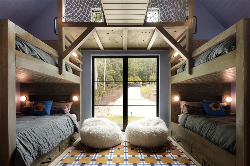 725 Rocky Point Drive Morganton, GA 30560 - Photo 89 of 157 a bedroom with furniture and a large window