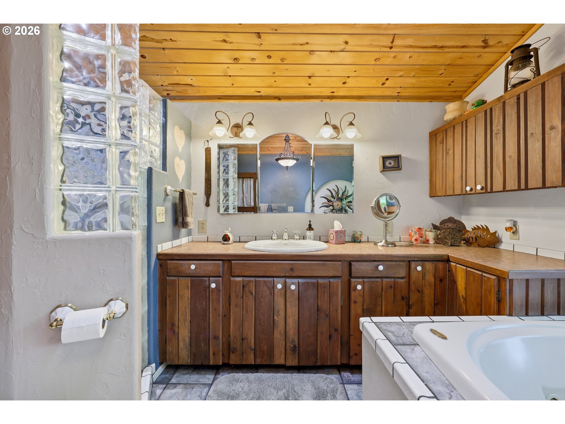 4209 P Street Washougal, WA 98671 - Photo 13 of 38 a spacious bathroom with a sink a mirror and bathtub