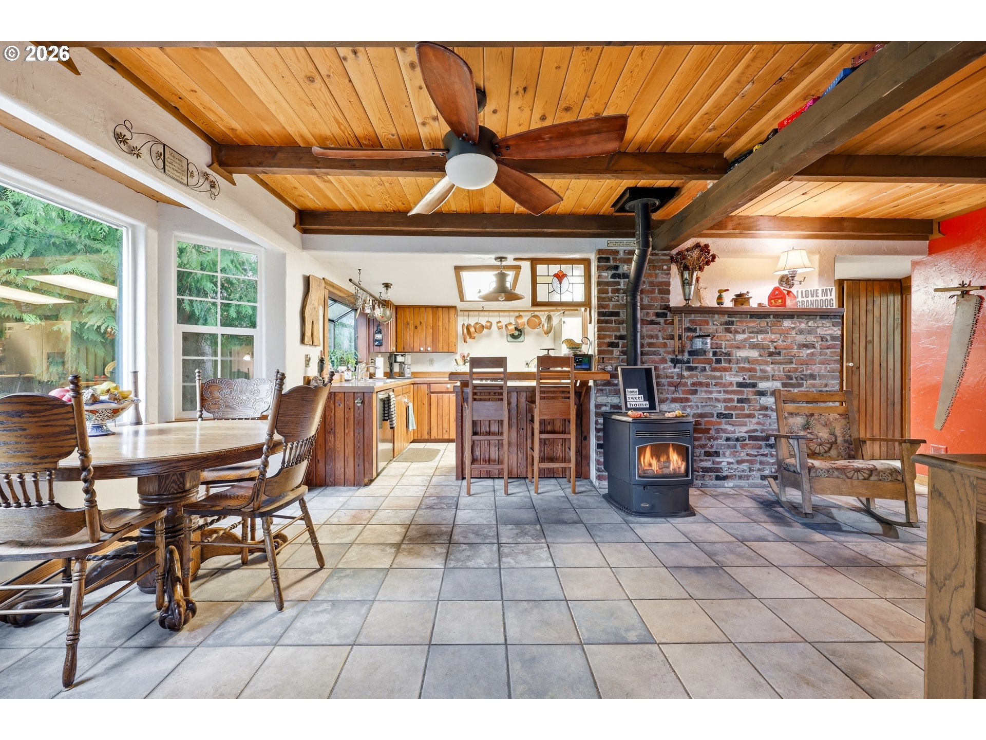 4209 P Street Washougal, WA 98671 - Photo 8 of 38 a view of a patio with table and chairs a barbeque with wooden floor