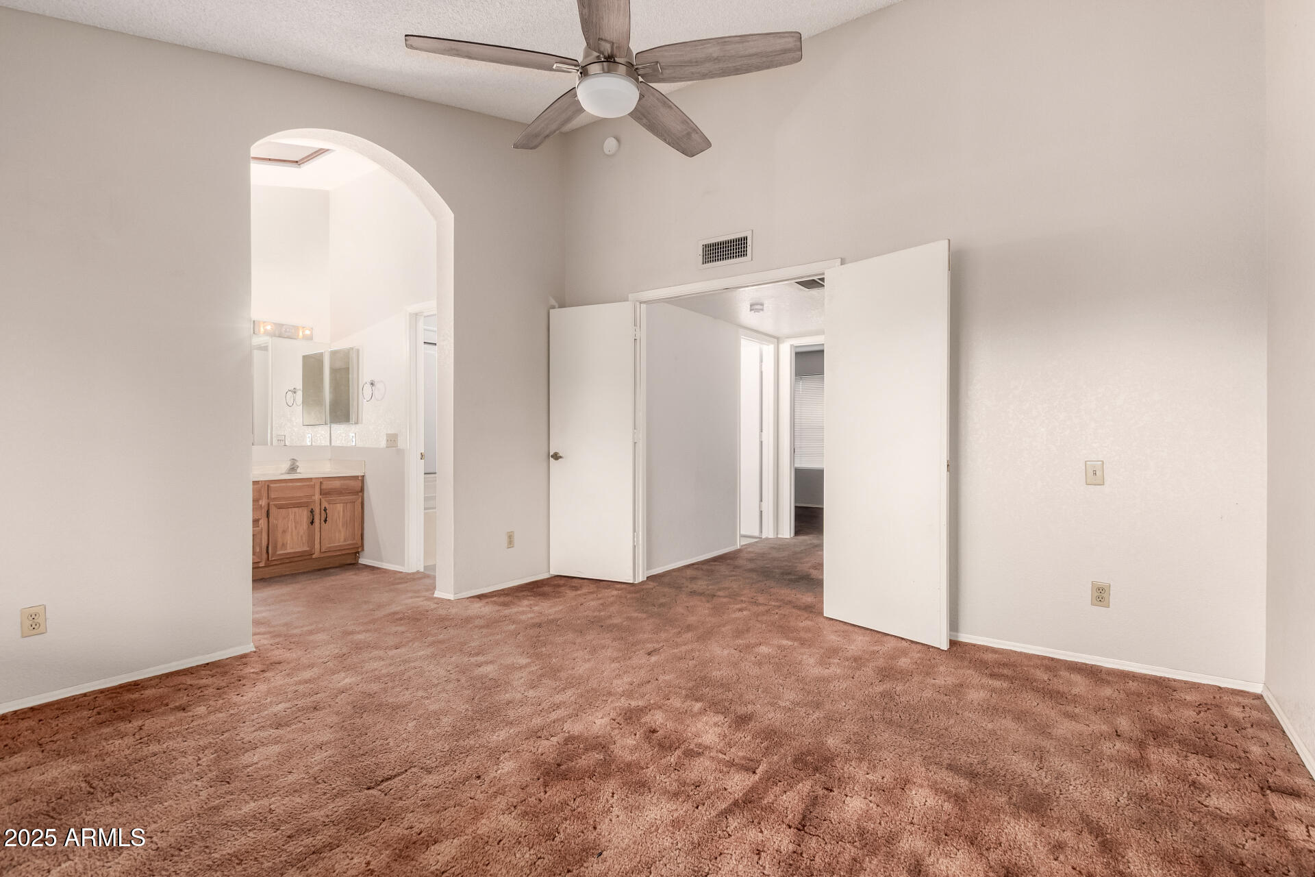 1729 West Brooks Street Chandler, AZ 85224 - Photo 15 of 33 a view of a big room with closet and a chandelier fan
