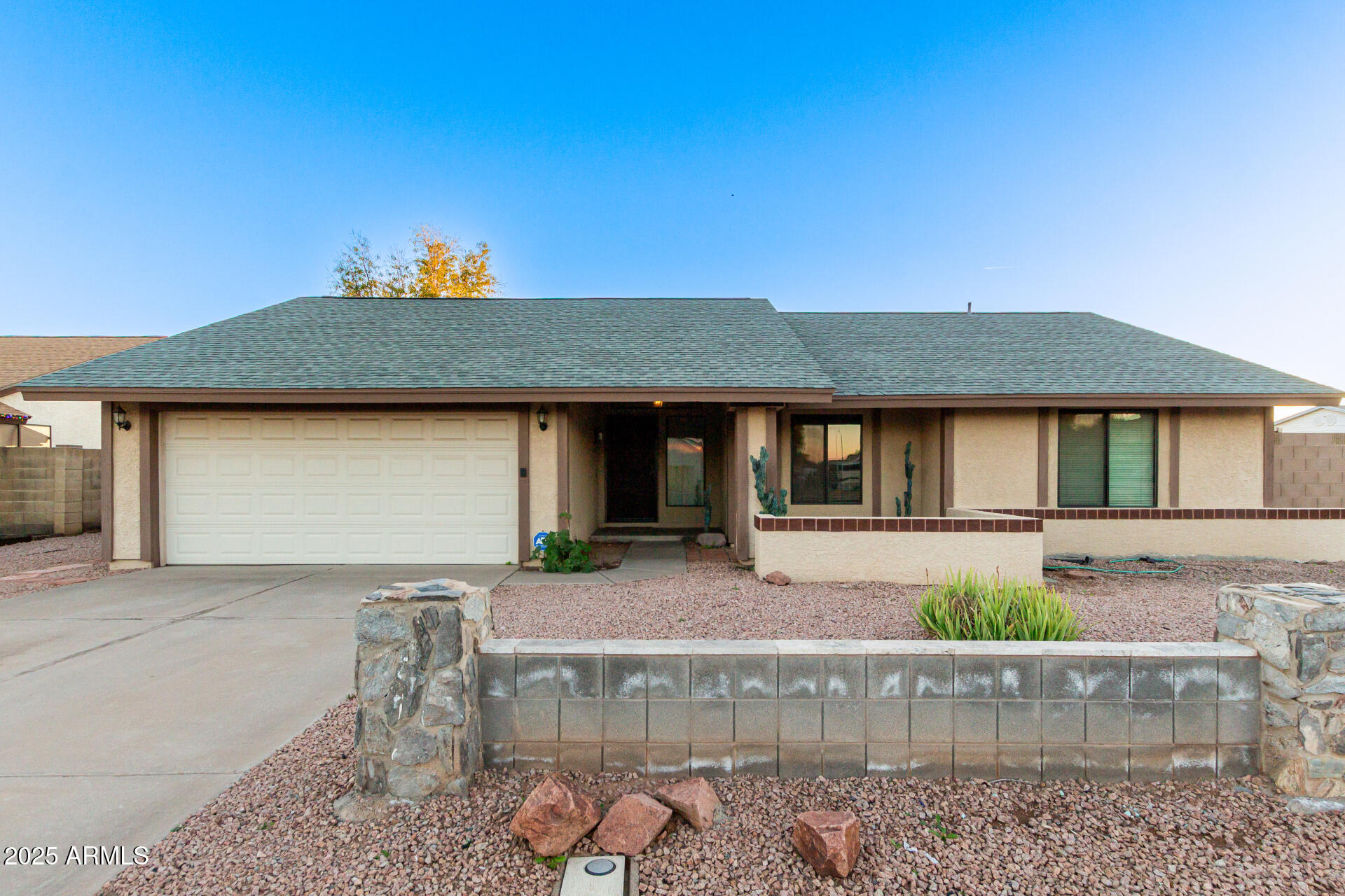 1729 West Brooks Street Chandler, AZ 85224 - Photo 2 of 33 a front view of a house with garden